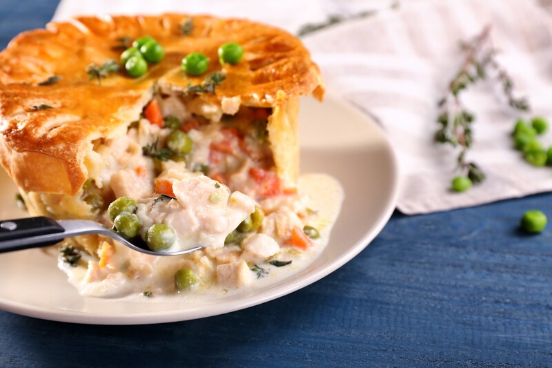 CHICKEN POT PIE - Prime cuts of oven roasted Swiss Chicken folded into a creamy white sauce with garden peas, freshly diced carrots, complementary spices, seasoned with salt and pepper. CHICKEN POT PIE - Prime cuts of oven roasted Swiss Chicken folded into a creamy white sauce with garden peas, freshly diced carrots, complementary spices, seasoned with salt and pepper.