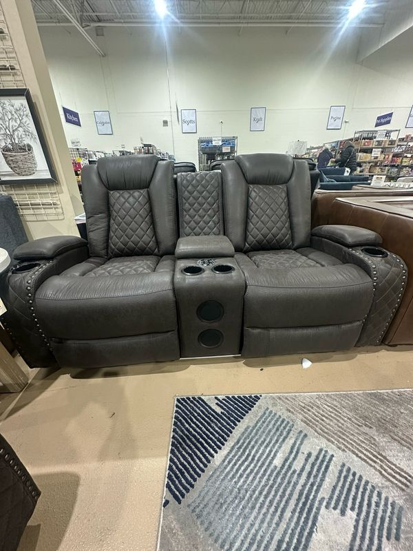Power reclining Loveseat Omega brown w/ Bluetooth speakers & power headrest,  Retails for $1995, Now $1149