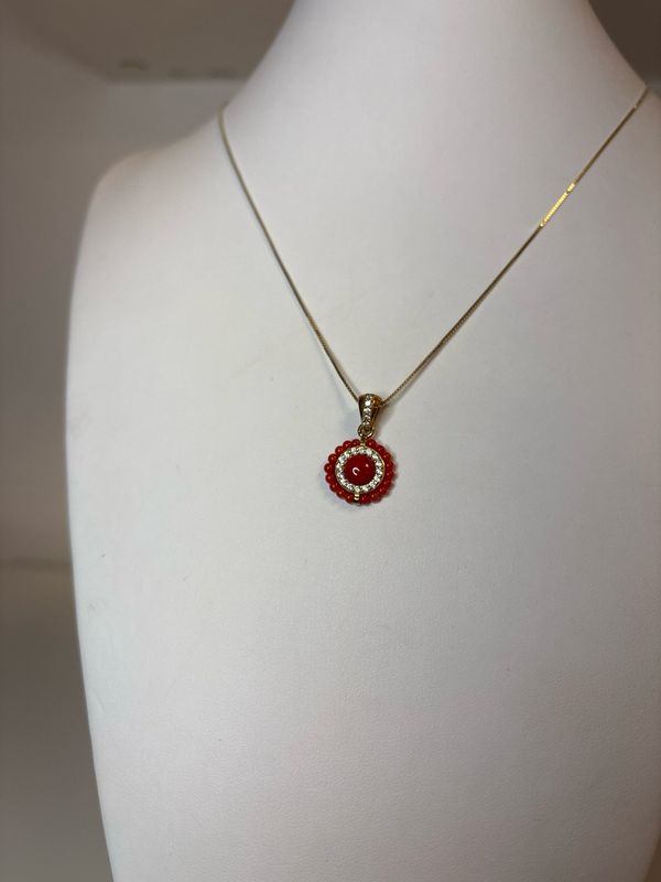 Collana in argento 925 e ciondolo in argento 925 con zirconi e corallo mediterraneo.