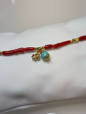 Bracciale in corallo mediterraneo, montato in argento 925 bagnato in oro con ciondolo in pasta di turchese