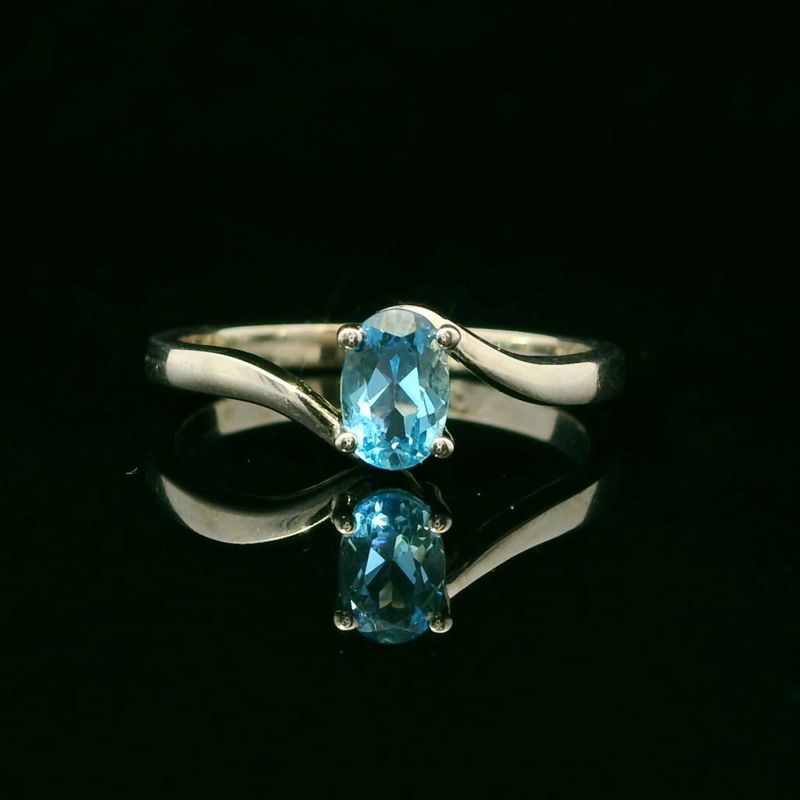 14KWG Blue Topaz Oval Bypass Ring