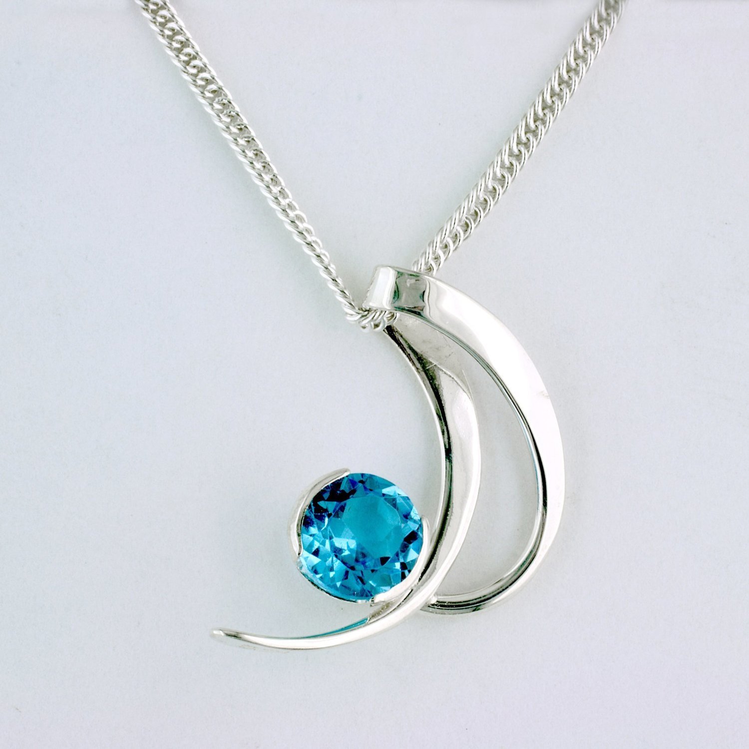 Sterling Silver Blue Topaz Crescent Pendant