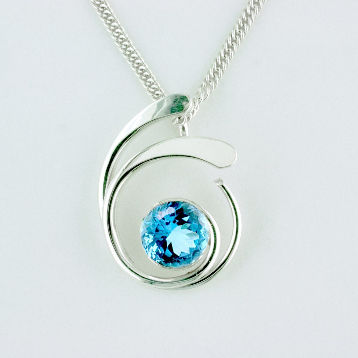 Sterling Silver Blue Topaz Four Curl Pendant
