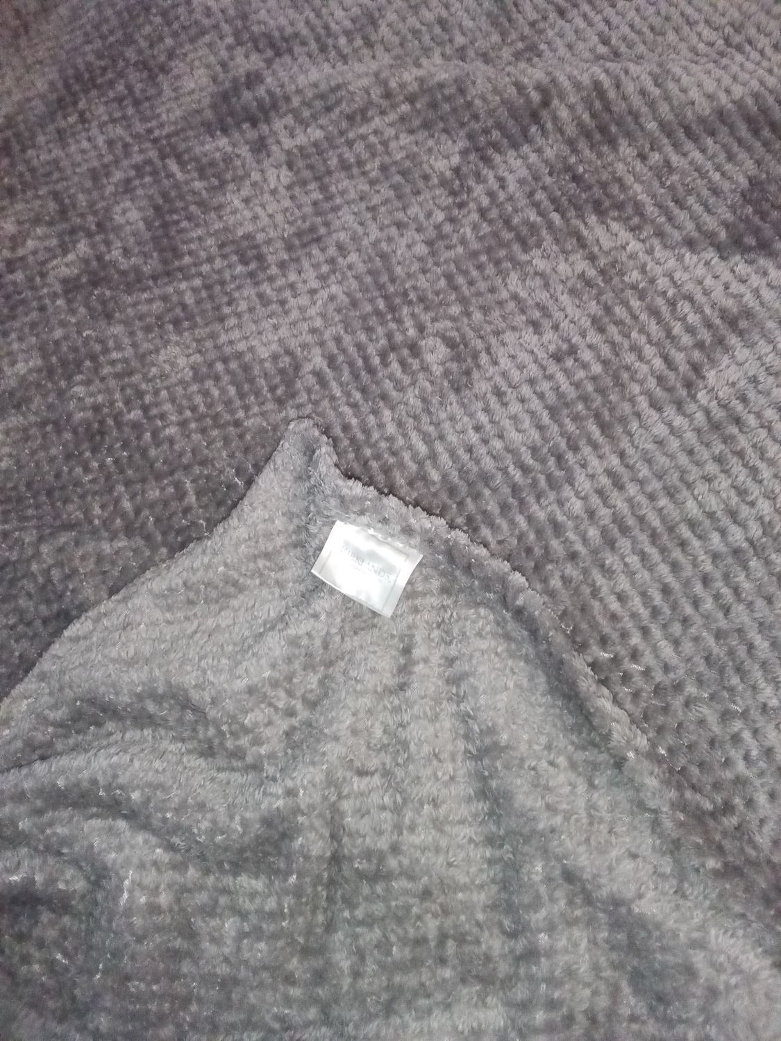 Kirkland's gray fuzzy blanket