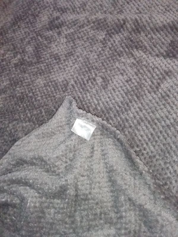 Kirkland's gray fuzzy blanket