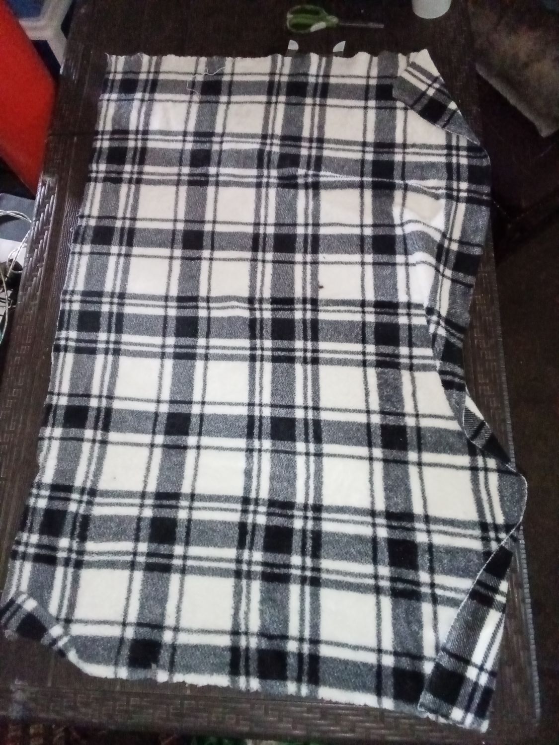 white and black plaid fleece blanket