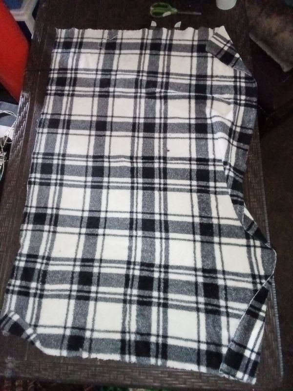 white and black plaid fleece blanket