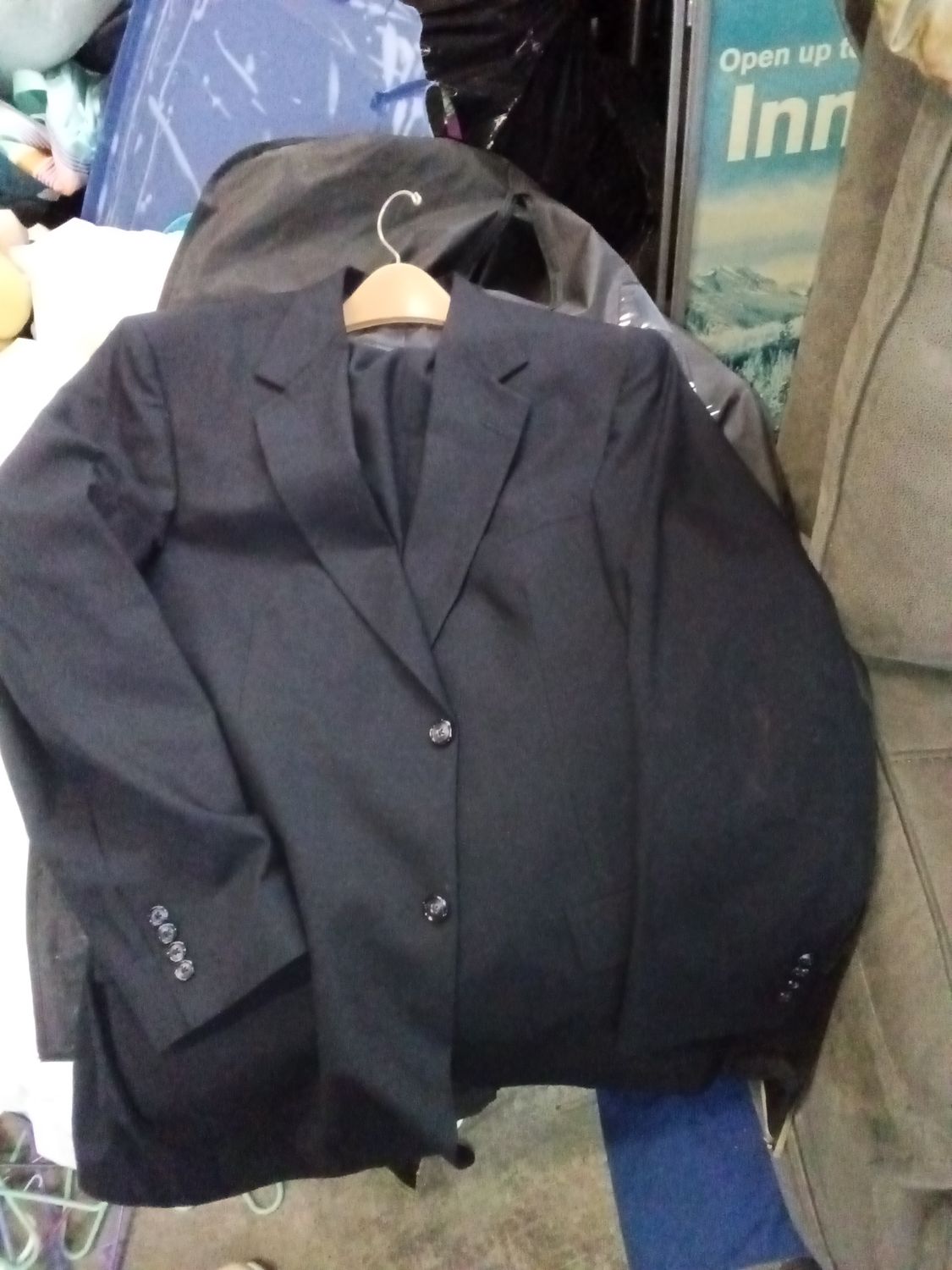 Roundtree &amp; Yorke suit jacket from Dillard's, appearing in solid black.