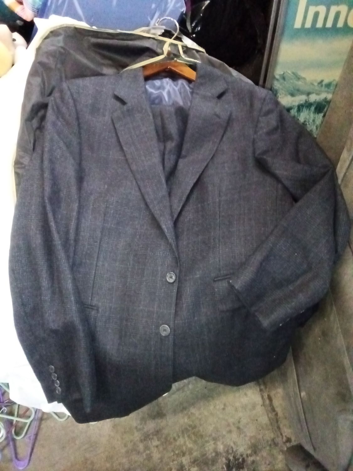 grey wool-blend suit jacket by Renoir features a two-button closure and a subtly textured fabric.