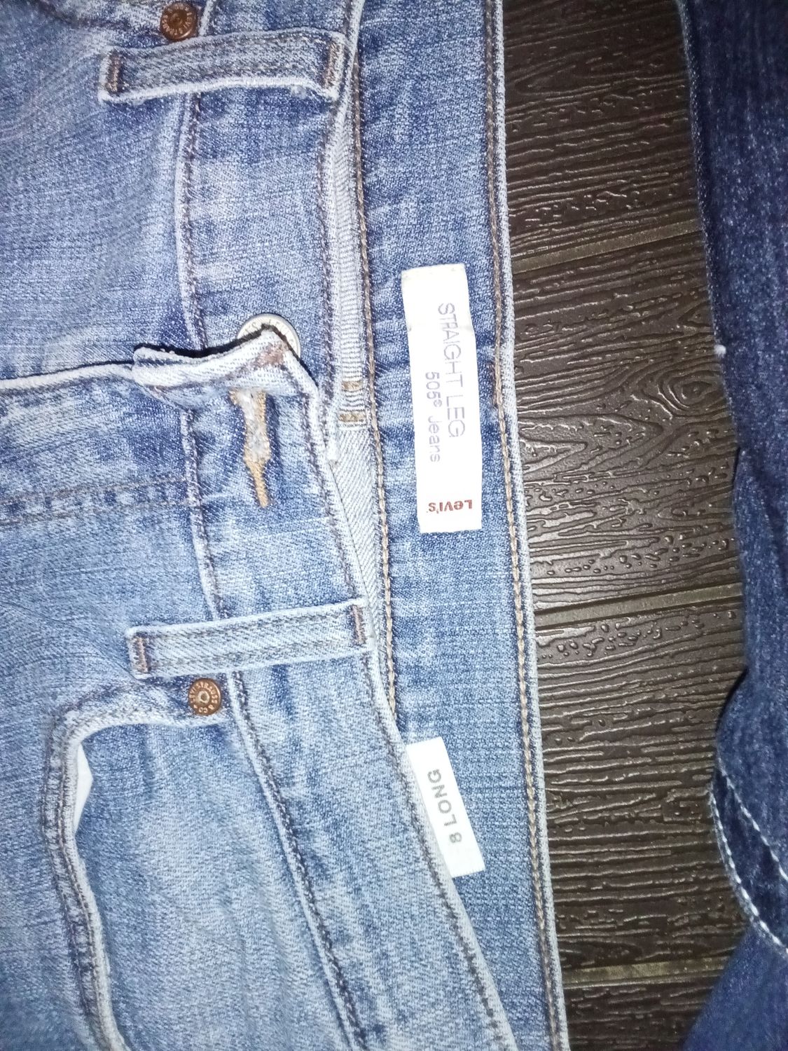 Levi's 505 Straight Leg jeans in a light blue denim wash, featuring a classic fit and zip fly. Size 8