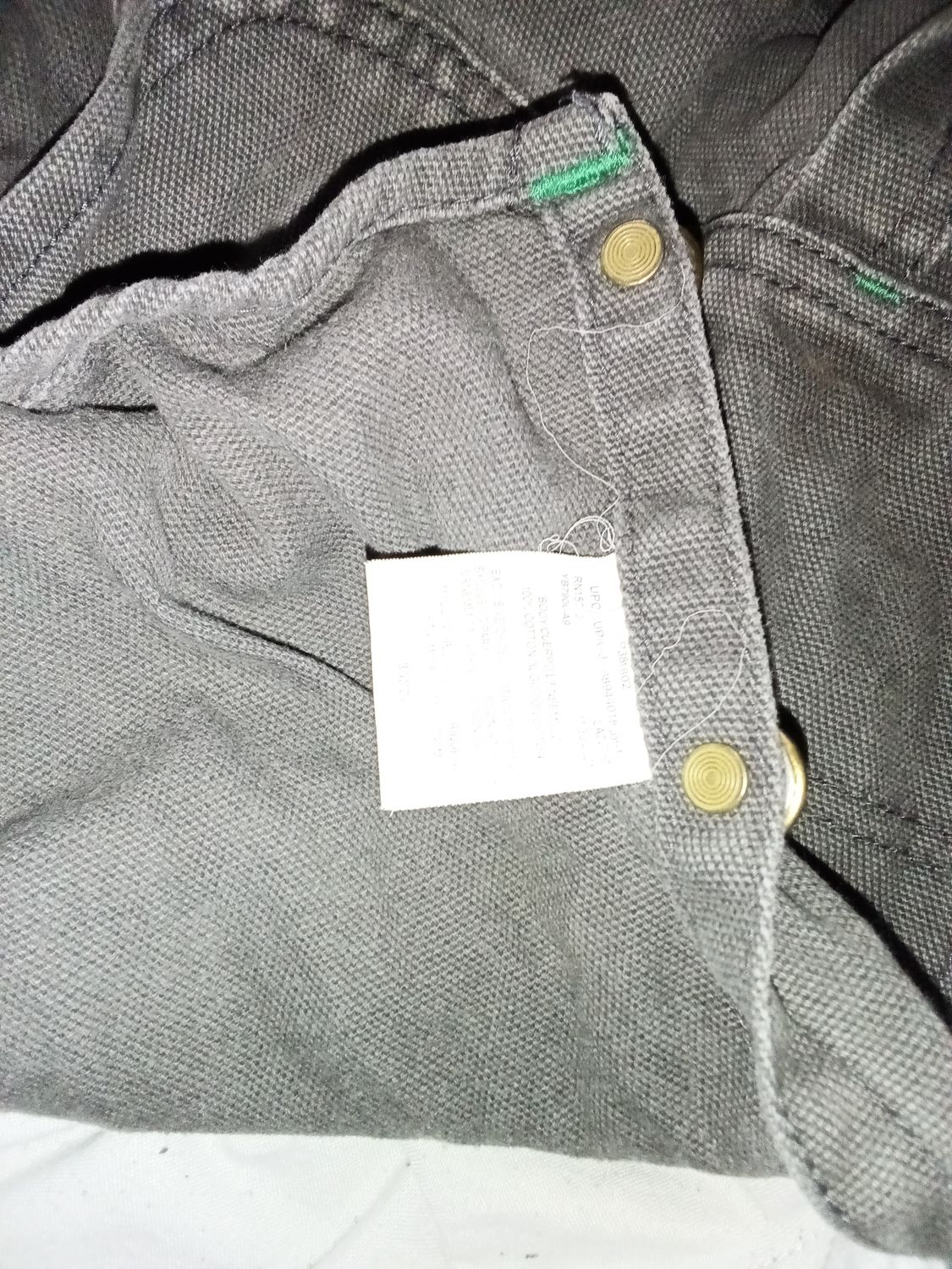 charcoal Liberty bib overalls feature a distinct signature green pocket zipper and accent. Size 38x32