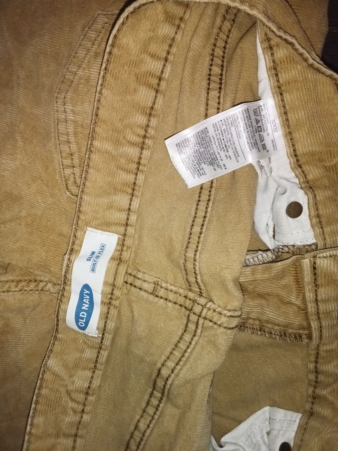 Brown corduroy pants are from Old Navy and feature a classic 5-pocket design with contrast stitching. 32x32