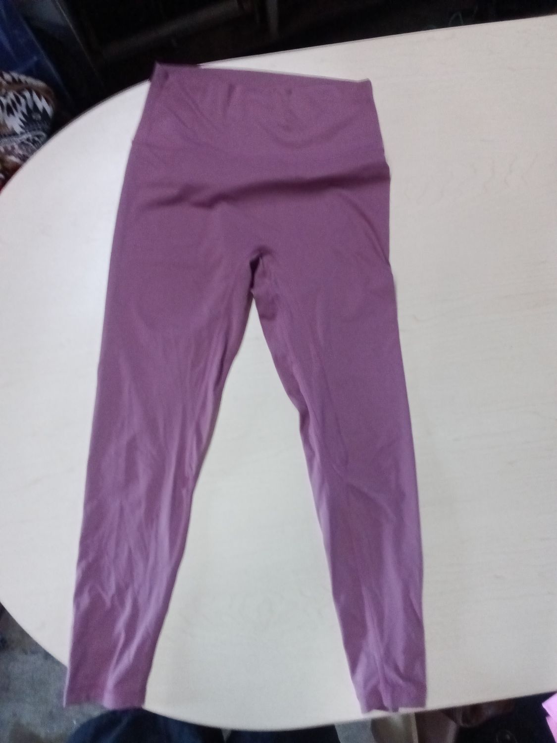 purple leggings feature a distinct foldover waistband
