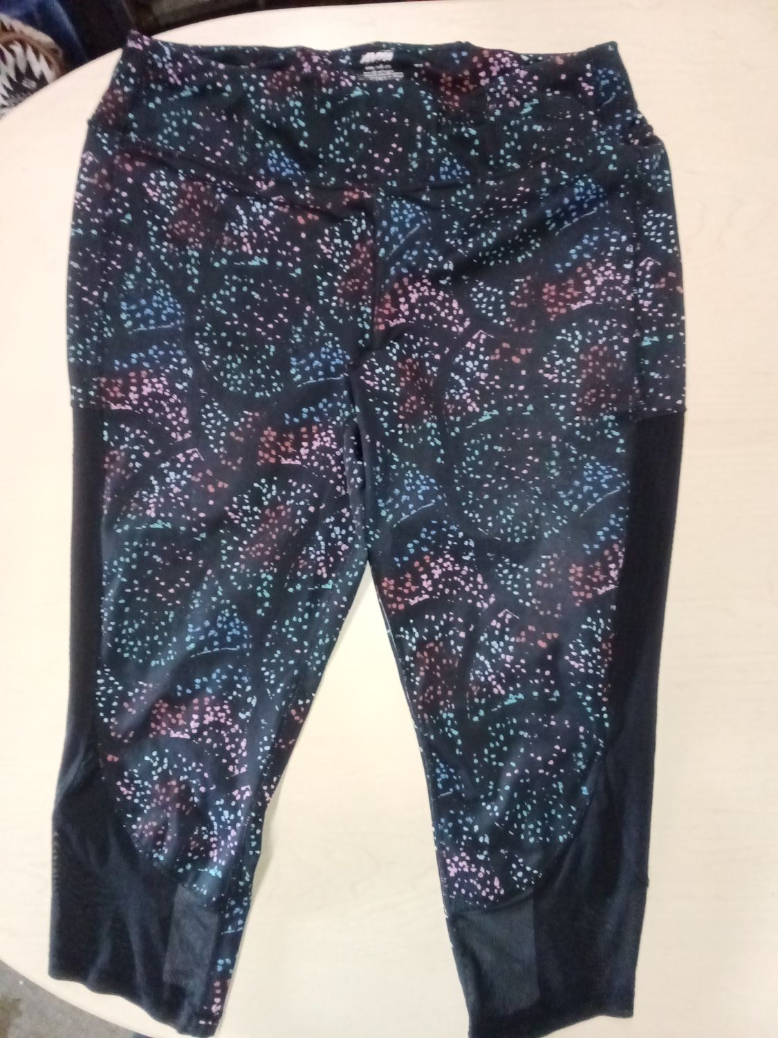 Avia brand women's leggings featuring a colorful splatter paint pattern. XXL