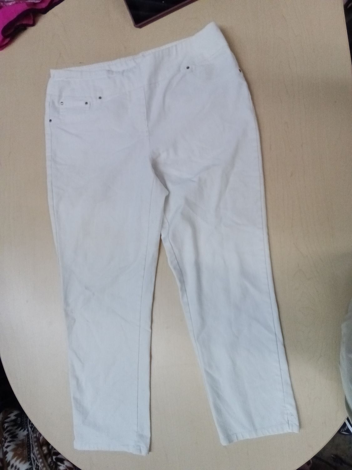 Ruby Rd. brand white pants featuring a prominent orange tag. Unknown size