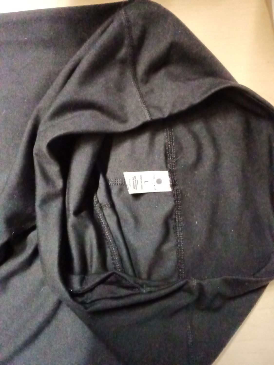 Yogalicious Lux black leggings in size large with a polyester and spandex fabric blend.