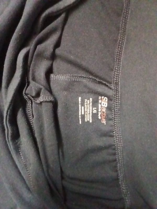 Black SJB Active by St. John's Bay activewear pants featuring a printed interior size Large