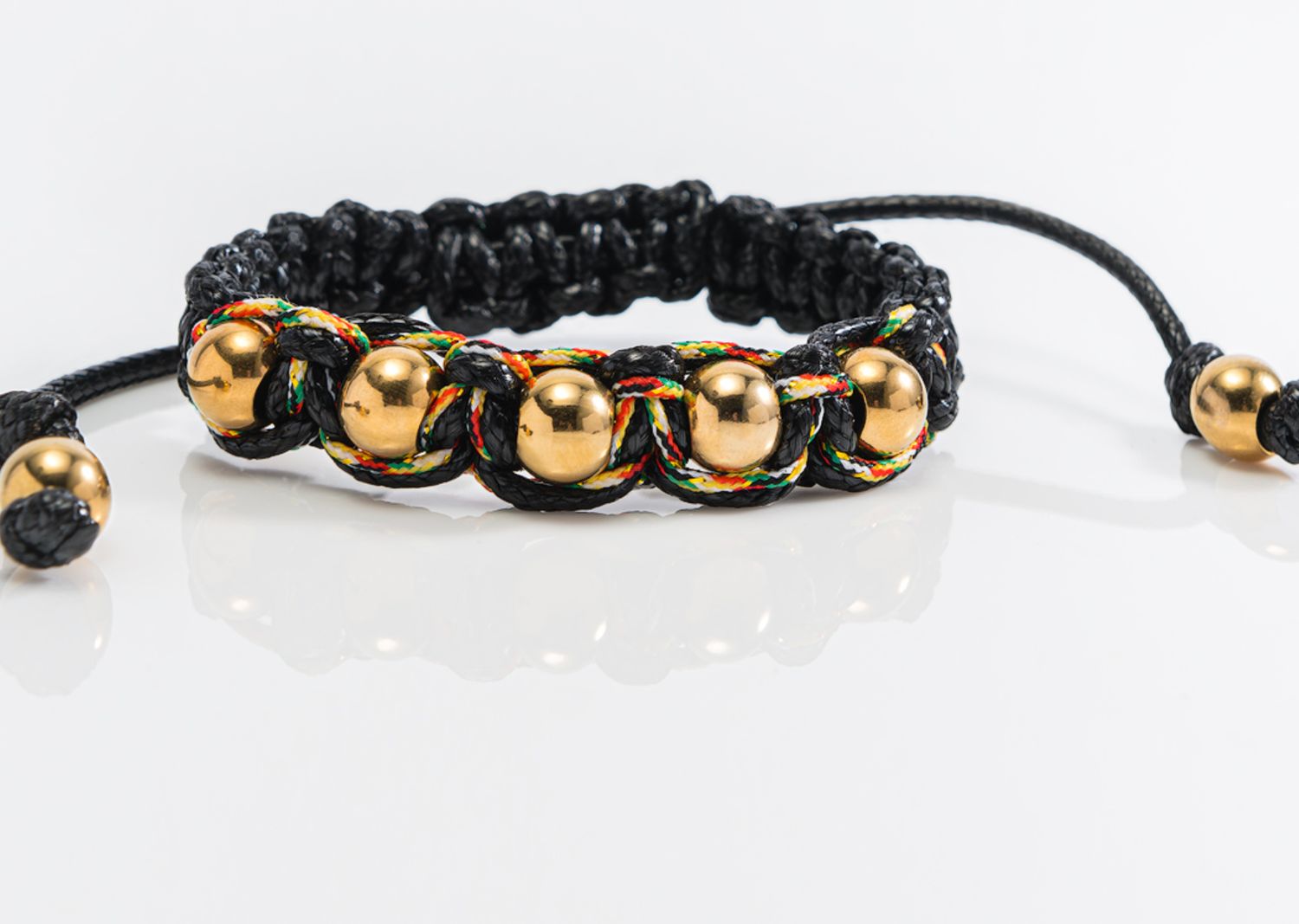 Pulsera Tejida con Balines dorados, Color: black