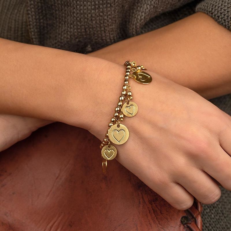 DD13525/BRACCIALE EL. PENDENTI MONETE/CUORE