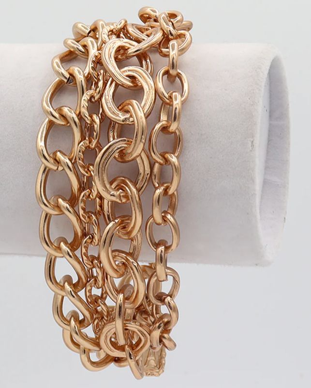 Multi layer bracelet featuring four rows of mixed chains.
