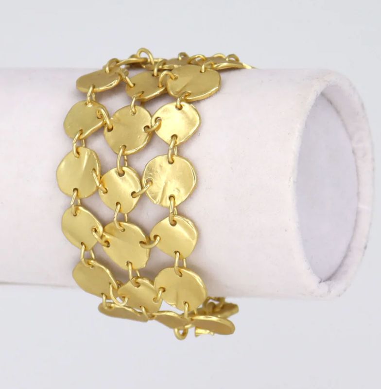 three rows of linked small medallions discs