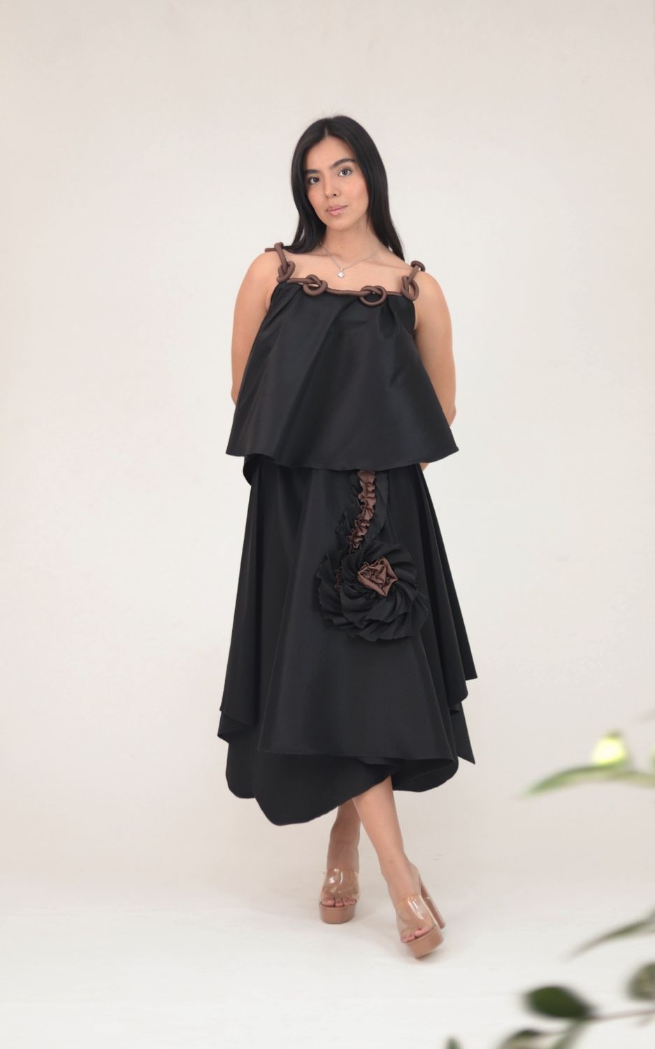  black two-piece set featuring a flowy layered