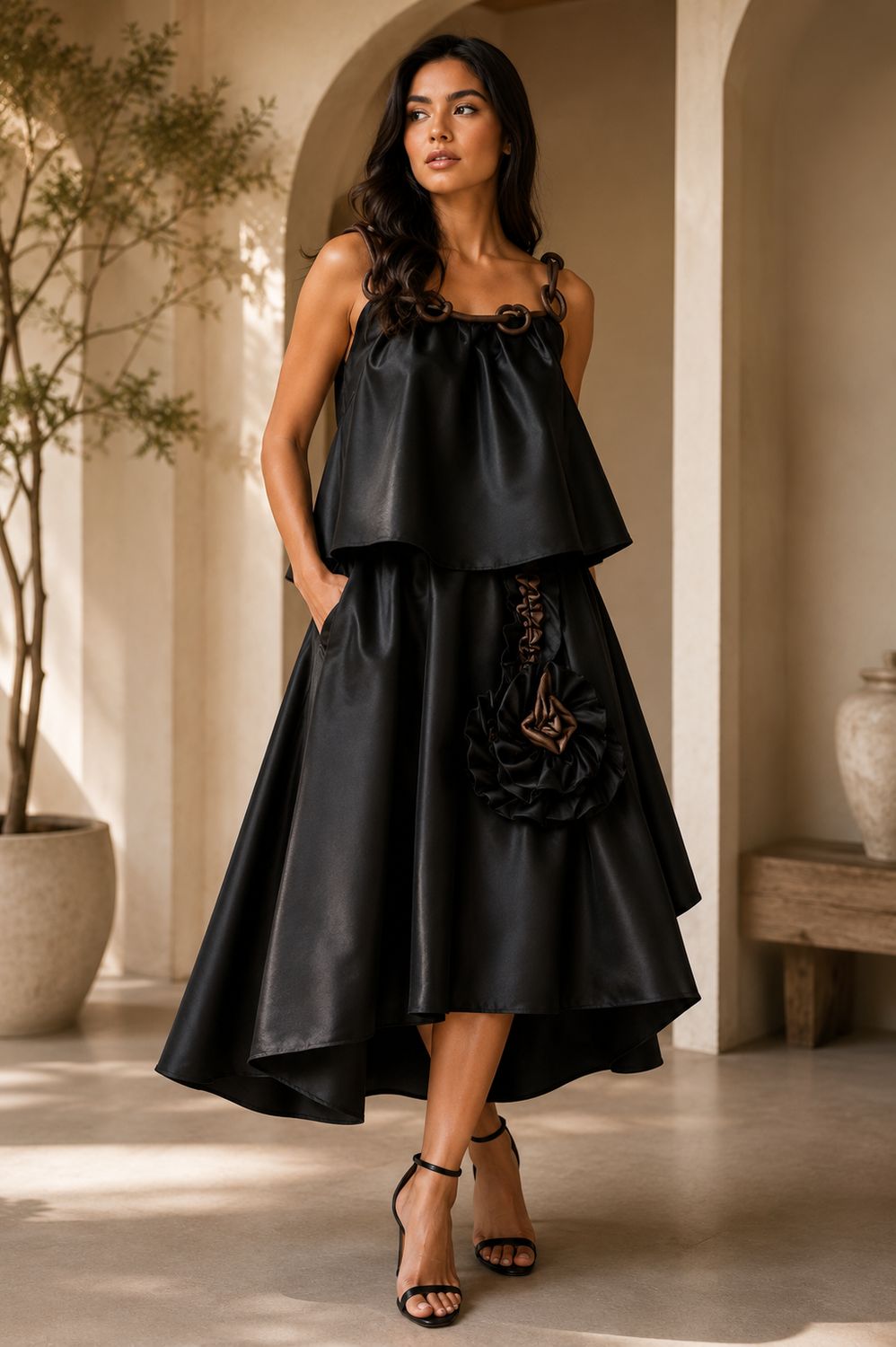  black two-piece set featuring a flowy layered