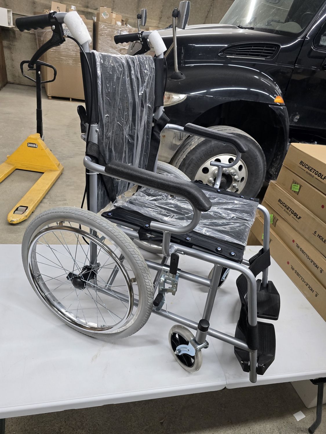 Wheelchair with standing-assist brakes