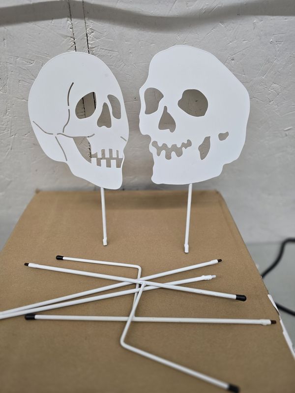2 Skull poke ground Halloween decorations up 30" tall