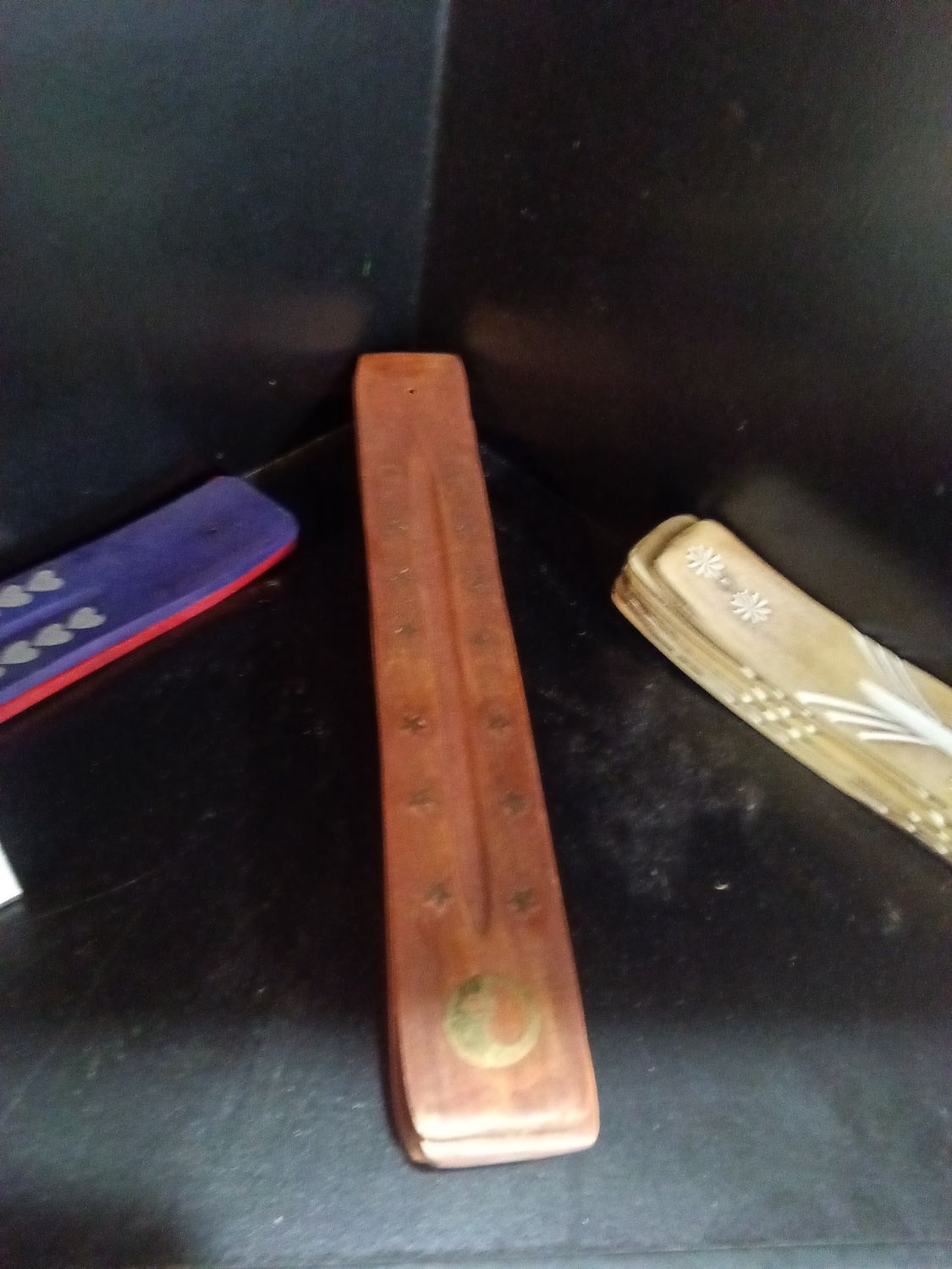 Dark brown wooden incense holders