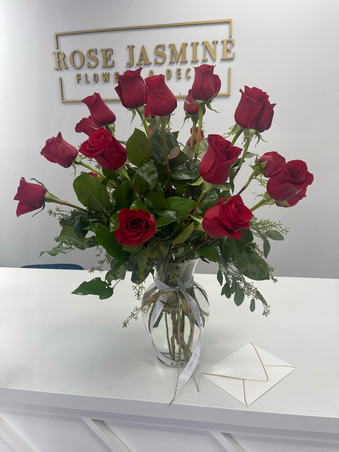 2 Dozen Premium Cut Roses In A Clear Vase  