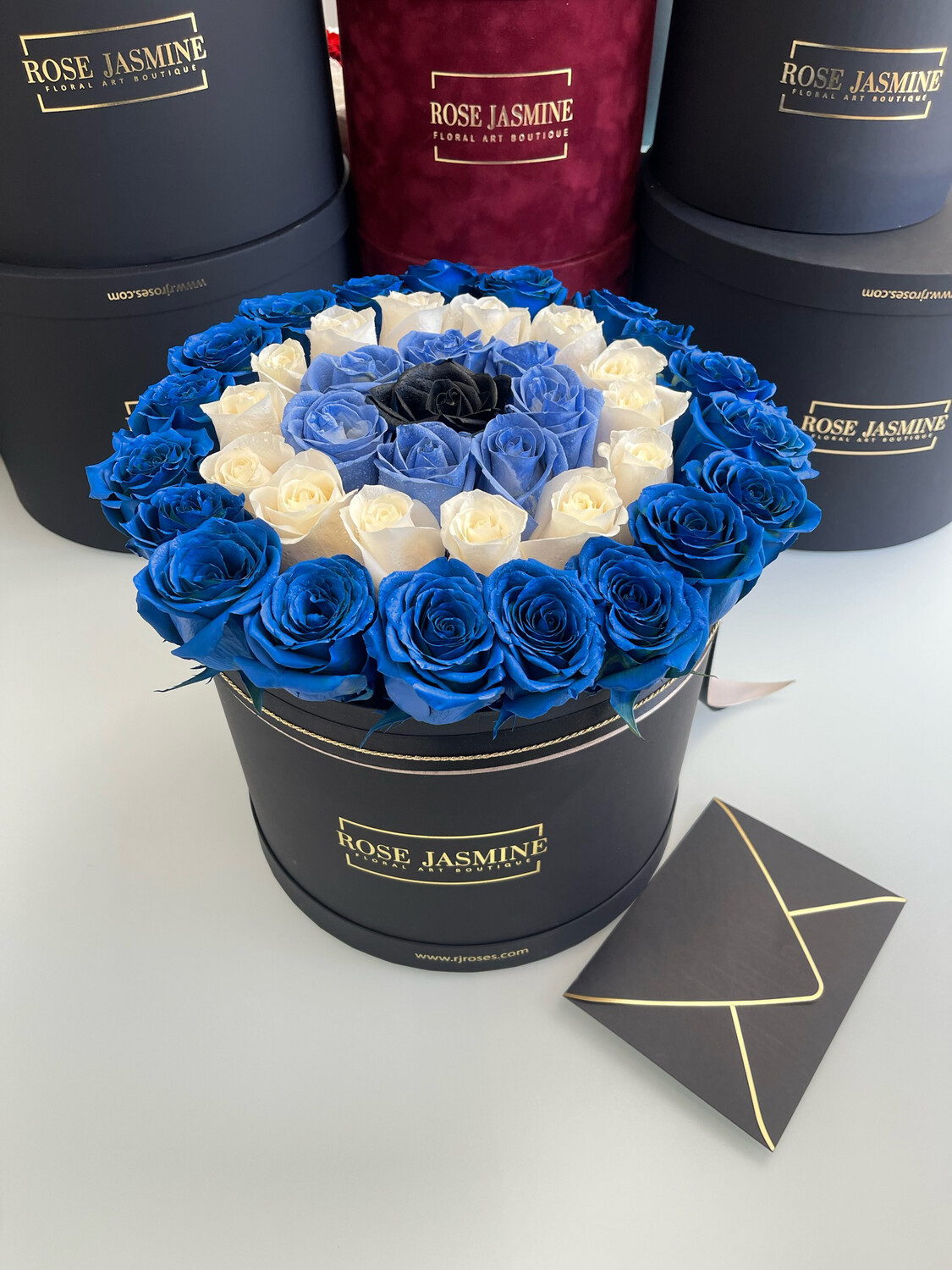 Colored Fresh Designer Roses In A Large Box