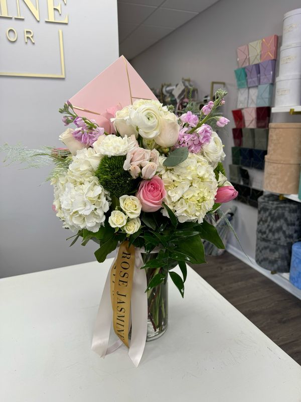 Floral Mixture In A Tall Cylinder Vase