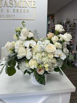 Elegant white arrangement in a ceramic vase 
