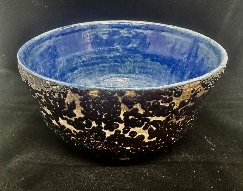 Black pebble bowl with blue interior