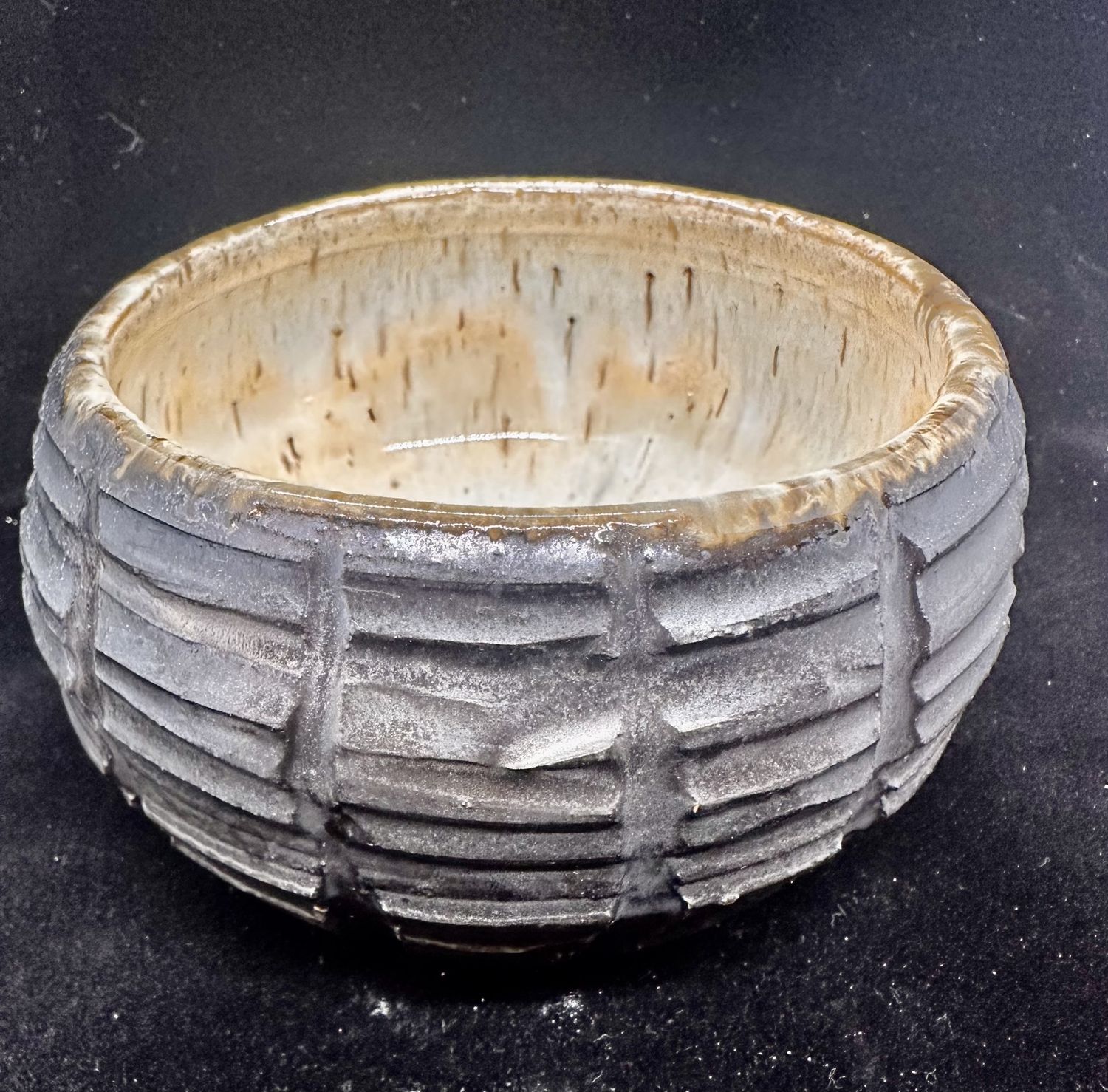 Incised metallic bowl