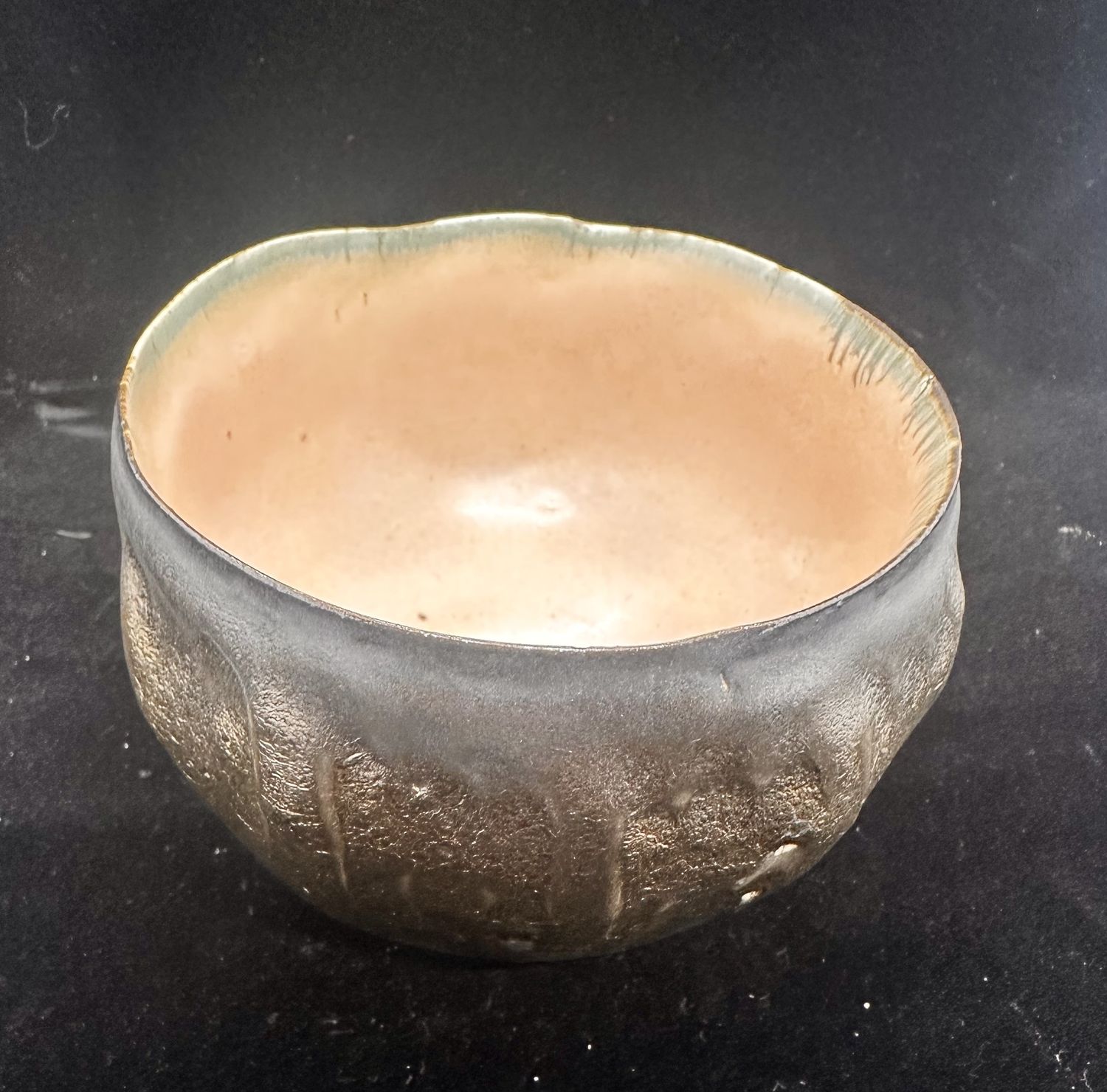 Bronze bowl with melon interior