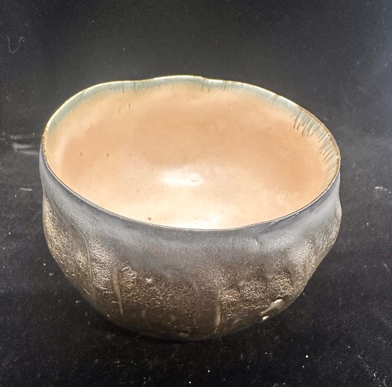 Bronze bowl with melon interior