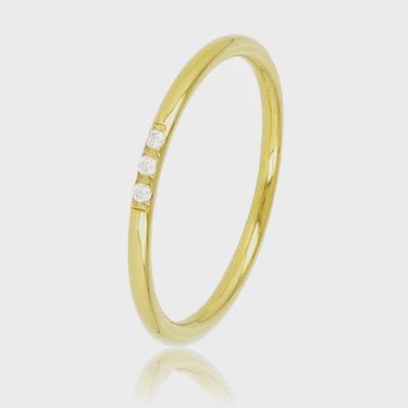 Minimalistische gouden ring - drie witte zirkonia stenen