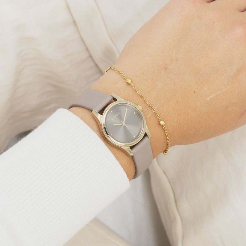 Goudkleurig horloge met taupe leren band