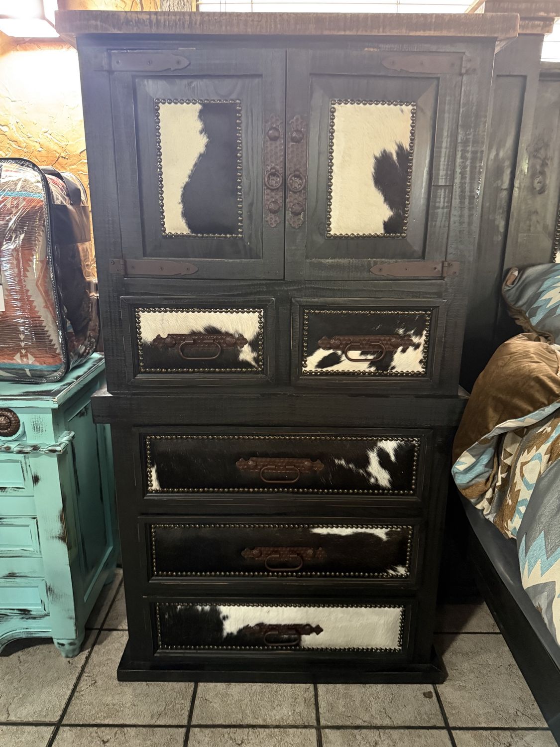 BLK MANSION 2 DOOR/5 DRW CHEST W/ BLK &amp; WHITE COWHIDE