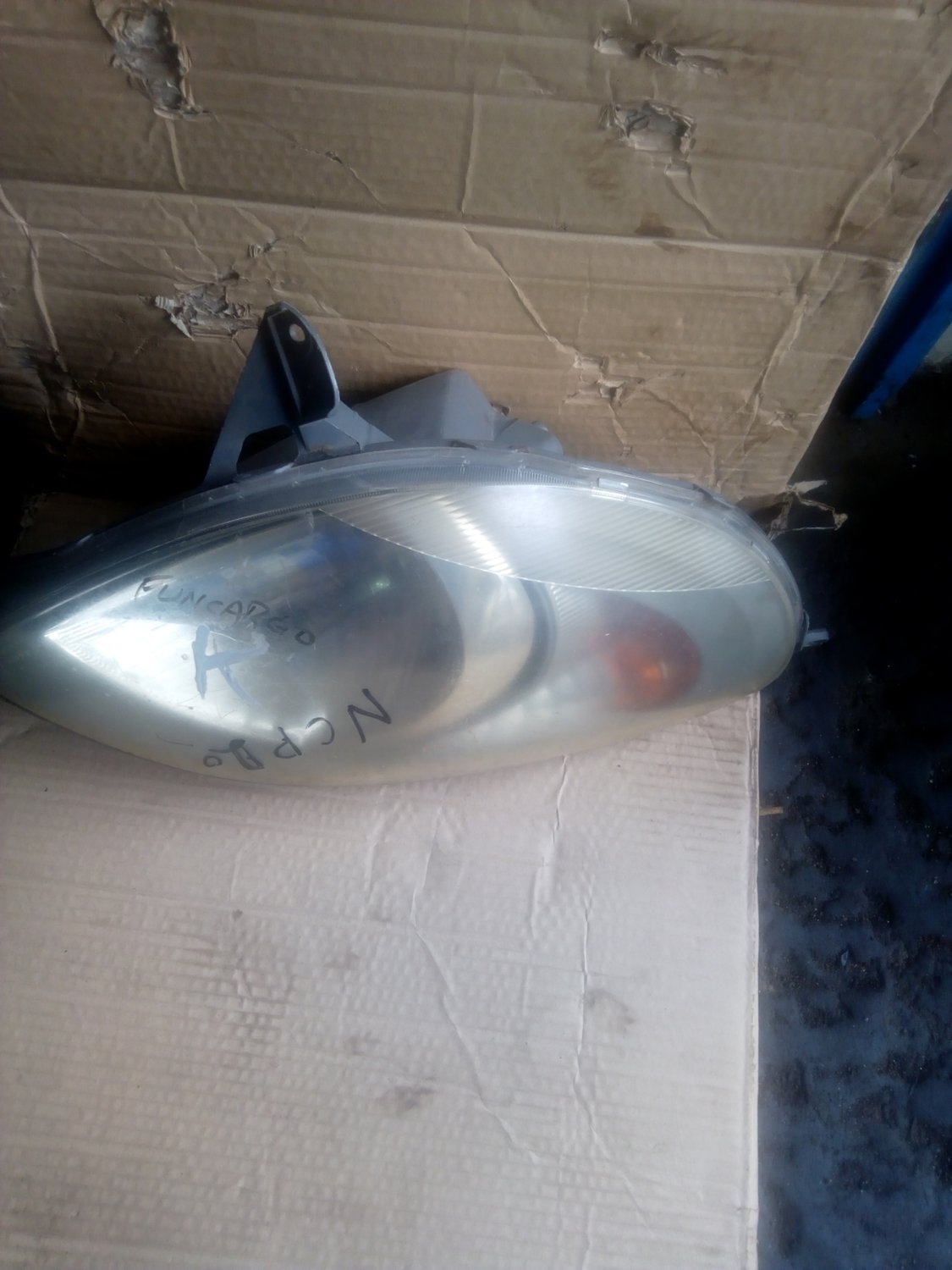 Toyota funcargo headlight