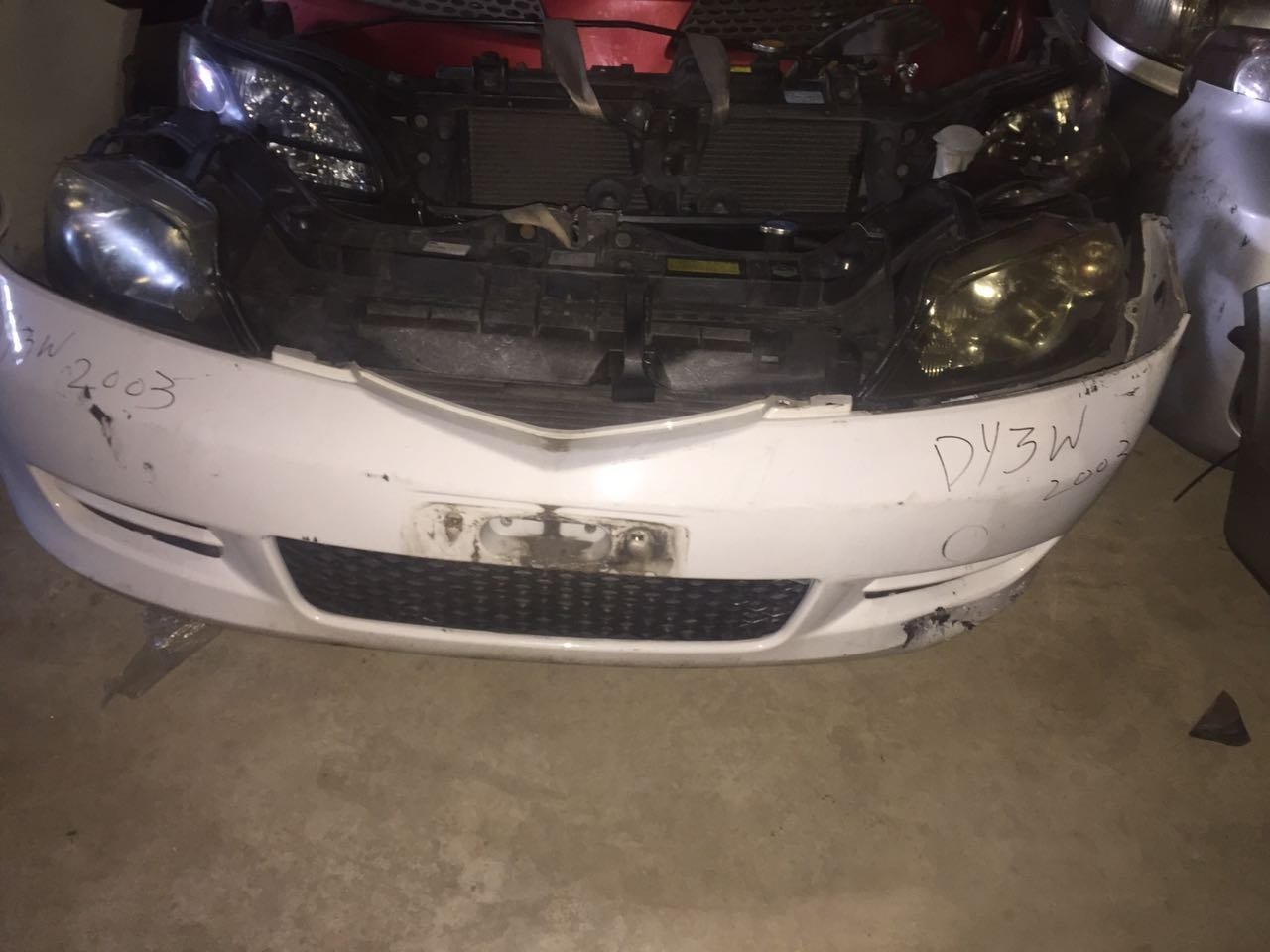 mazda demio nose cut