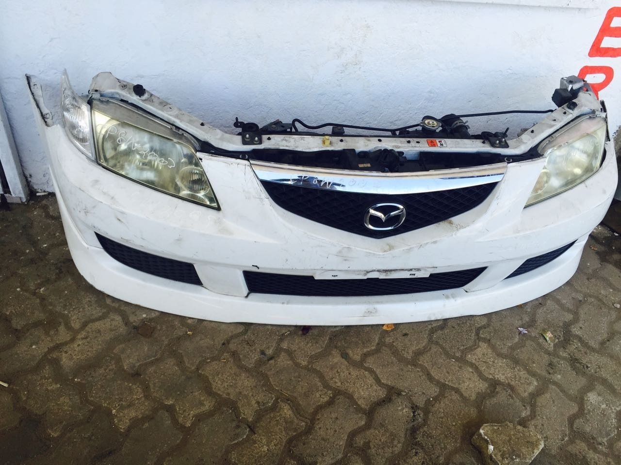 mazda demio nose cut