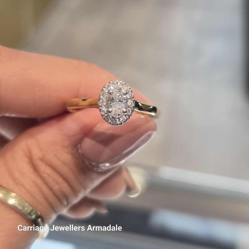 18ct Yellow Gold 0.40 Carat Oval Diamond Halo Ring