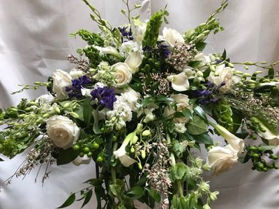 A Touch of Blue Casket Spray by Twigs Floral Design