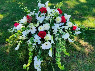 Splash of Love Casket Spray by Twigs Floral Design
