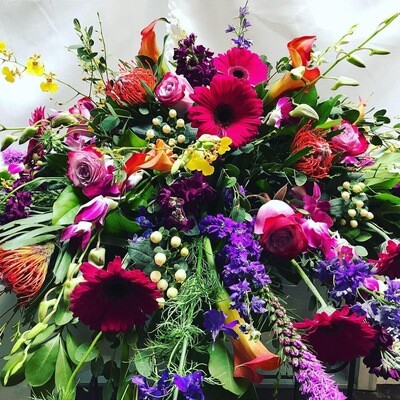 Vivid Hues Casket Spray by Twigs Floral Design