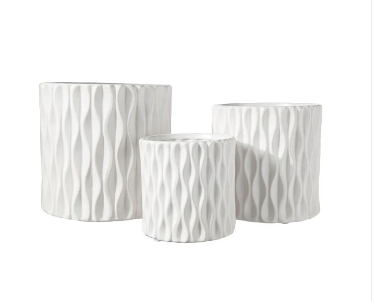 4.25”H X 4.25” SMALL WHITE CERAMIC CYLINDER WITH WAVE DESIGN PATTERN (sold by the piece, box has assorted sizes)