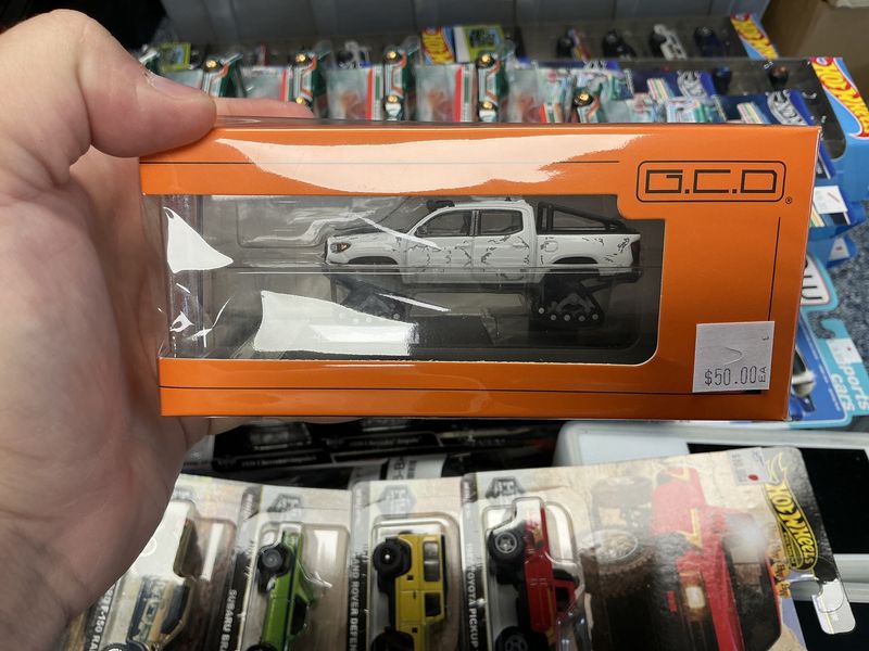 Toyota Tacoma white w/snow tracks